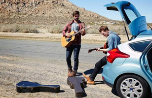 What are the issues of travelling by car with a guitar?